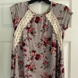 Floral blouse with lace up back.